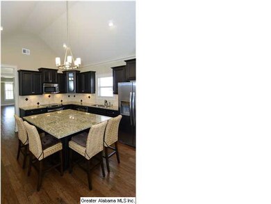 You'll love this kitchen with dark stained cabinet