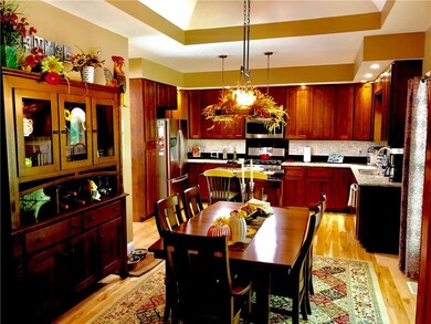 The dining room is open to the kitchen and also has custom crafted traded ceiling with inlay. Isn't it beautiful?