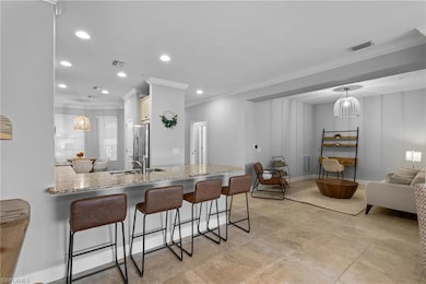 Kitchen featuring freestanding refrigerator, ornam