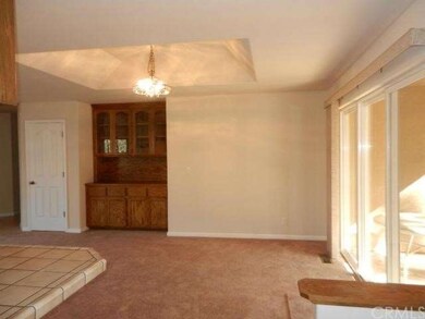 View from kitchen to dining with built in oak hutc