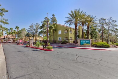 View of street with street lights, curbs, a gated