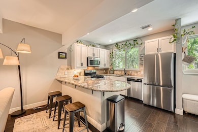 Kitchen featuring appliances with stainless steel