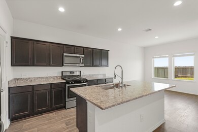 This kitchen conveniently connects to the breakfas