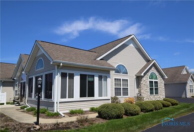 This condo sits on a corner with the garage off to