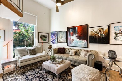 Large windows open to the living room with firepla