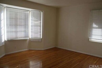 rooms with open windows and hardwood flooring.