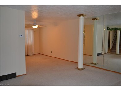 The living room flows into the formal dining room.