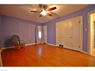 Large Master Bedroom with hardwood floors and two 