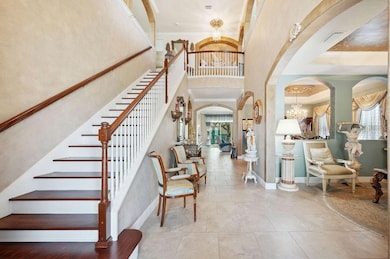 As you enter your greeted by soaring ceilings and a view to the second floor.