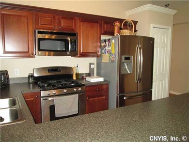 Kitchen. Beveled countertops & plenty of cabinets.