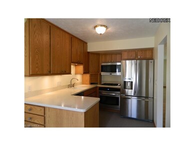 Eat in kitchen with corian countertops and stainle
