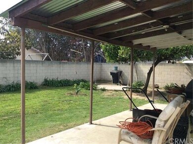 Rear yard with patio area fully grown trees to pro
