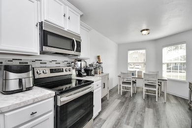 his inviting kitchen features a spacious layout wi