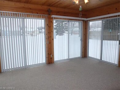 Enclosed porch is a great place to relax!