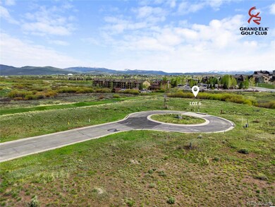 Prime golf-course exposure from Lot 6 with rolling fairways and mountain vistas defining the backdrop. Lot lines shown are approximate.