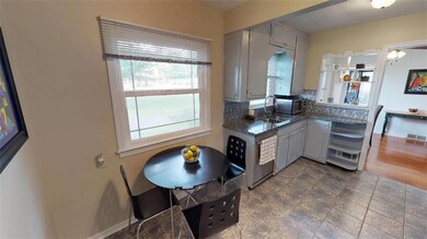 STAINLESS STEEL APPLIANCES & CERAMIC TILE FLOOR IN