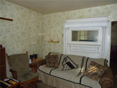 Living room with decorative fireplace.
