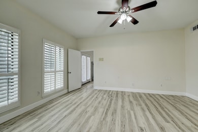 This room features light-colored hardwood flooring