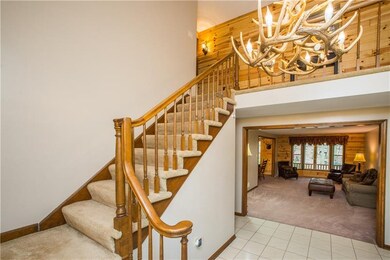 2 story entry w/ cool antler chandelier to match t