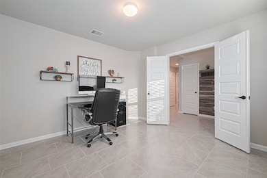 Spacious front room with double doors—ideal for a