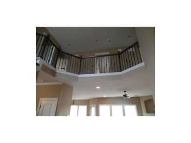 2 story entry with iron spindles