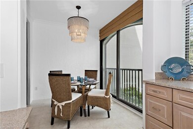 Dining room with light tile patterned floors, a ch
