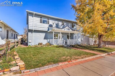 View of front of house featuring a porch, fence, a
