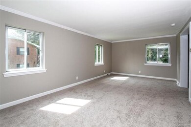 Off the entry is a large living space that could b