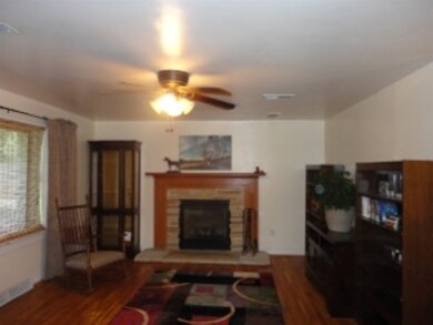 Living room has large picture window, faces West. 