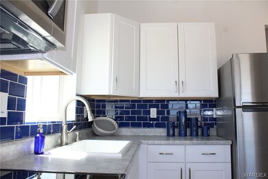 Gorgeous cobalt blue backsplash in kitchen