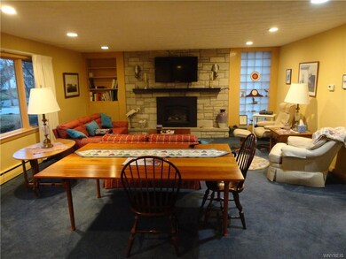 The living room offers a warming gas fireplace & b