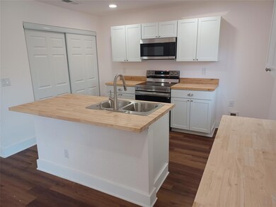 Kitchen with stainless steel appliances, wooden c