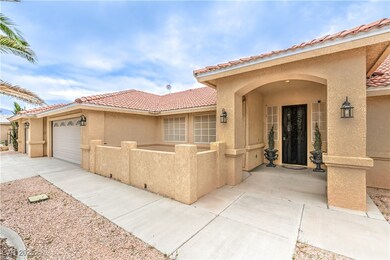 Property entrance featuring stucco siding, a tile