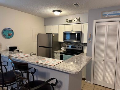 Kitchen with appliances with stainless steel finis