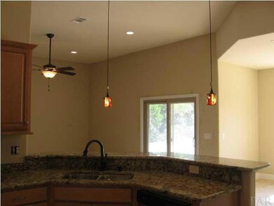 Open plan living area from kitchen - 11' ceilings with opening to dining area with 9' ceiling
