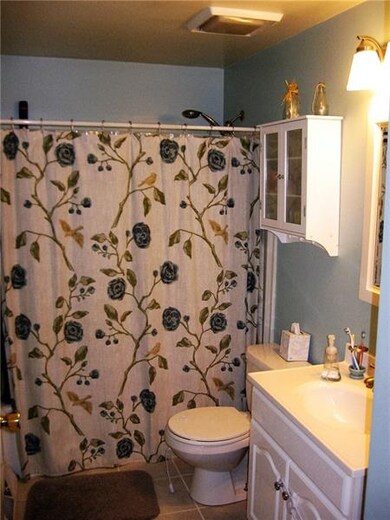 Updated bath with new with new vanity and tile flo