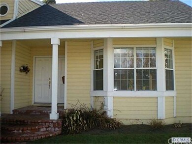 Brick front porch and a large living room bay wind