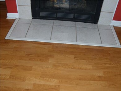 The fireplace tile and laminate livingroom floor