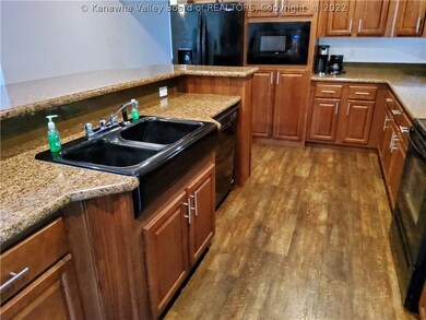LOTS OF CABINETRY & ISLAND VERY SPACIOUS W/BAR SEA