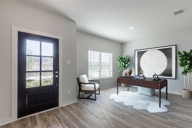 The foyer opens to a well-proportioned front office / flex room which has recessed lighting and a large window.