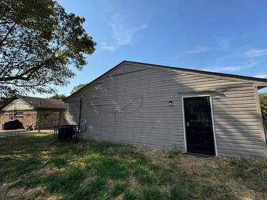 View of home's exterior with central AC