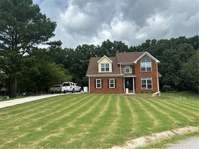 View of front of property featuring a front lawn
