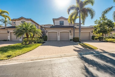View of front of home featuring decorative driveway, stucco siding, and a garage