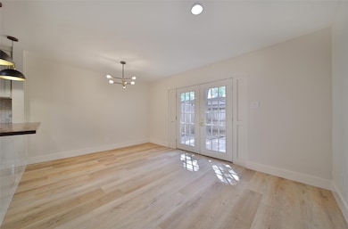 Dining room and office space looking out to the ba