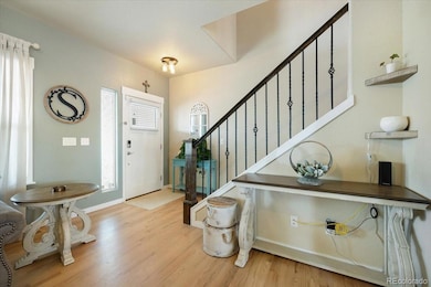 Interior Front Entry with iron rails to the upper level.