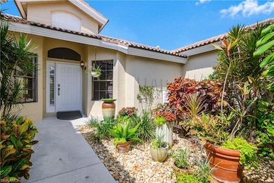 Property entrance featuring stucco siding and a tiled roof