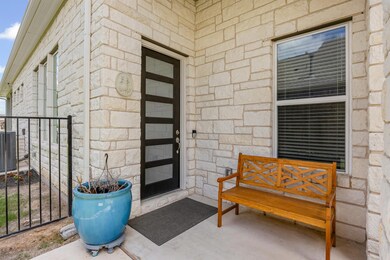 Doorway to property featuring stone siding