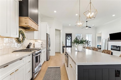 Gorgeous open-concept kitchen featuring quartz cou