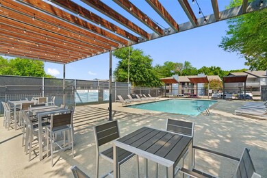 View of swimming pool featuring a patio and a perg