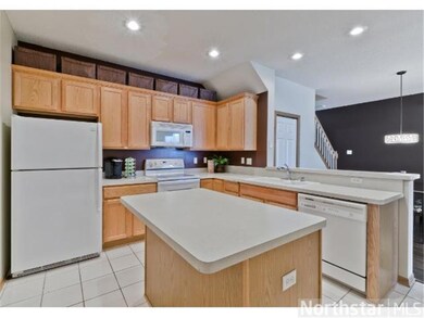Great kitchen with tile floor, smooth-top range, a